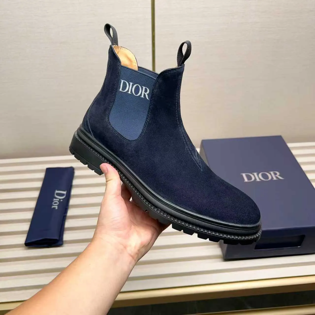Men's Shoes 💰480 Dior A practical choice that combines protection with classic style. Made from durable Rugged Calf leather, it's tumbled and hand-finished to create a soft suede feel with a rich texture. Elastic side panels and subtle cutouts are inspired by the classic Chelsea boot. Leather upper and lining with Kummel tabs at front and rear, rubber outsole